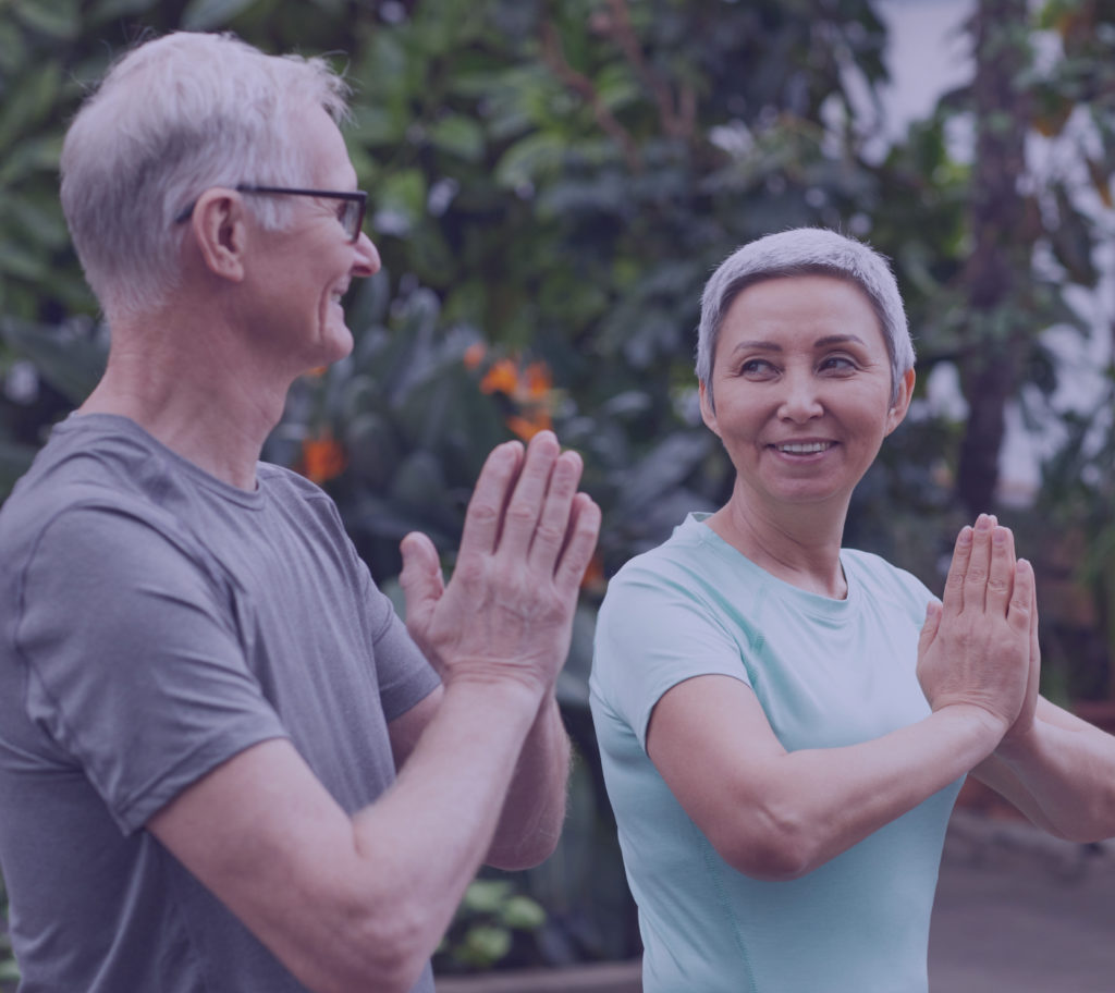Older couple doing a yoga workout